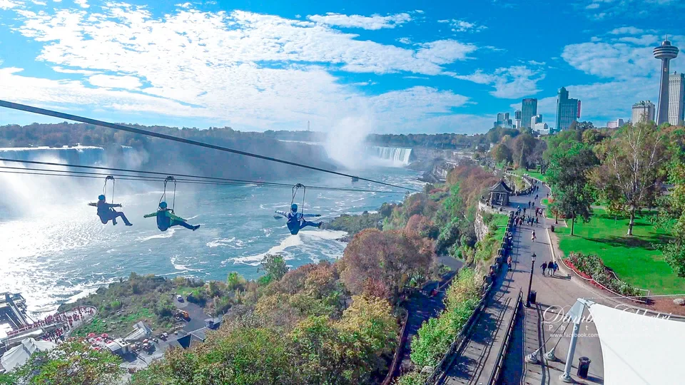 A panoramic view of waterfalls and the nearby promenade