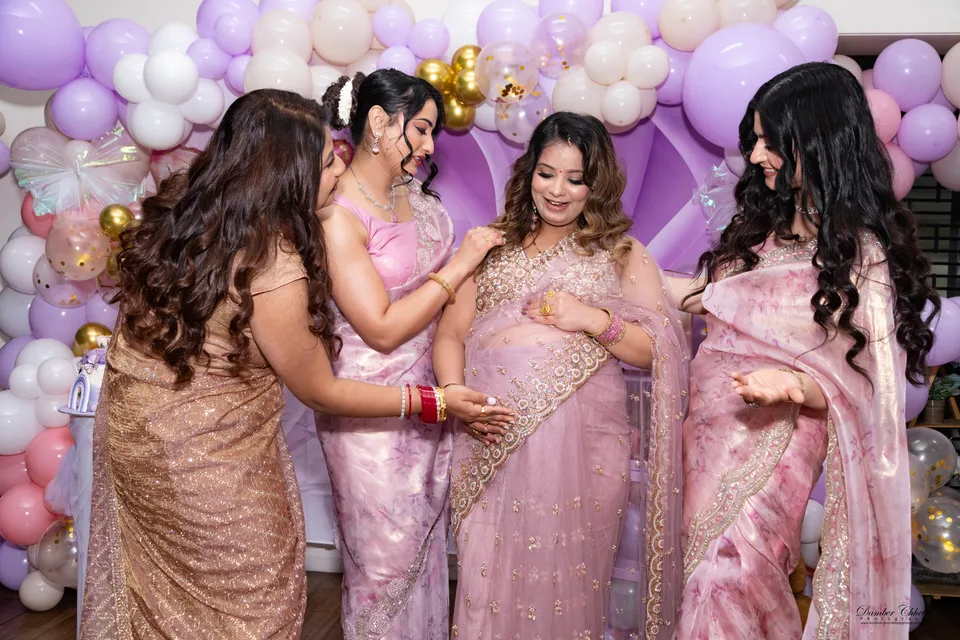 Women dressed in pink gathering for a celebration